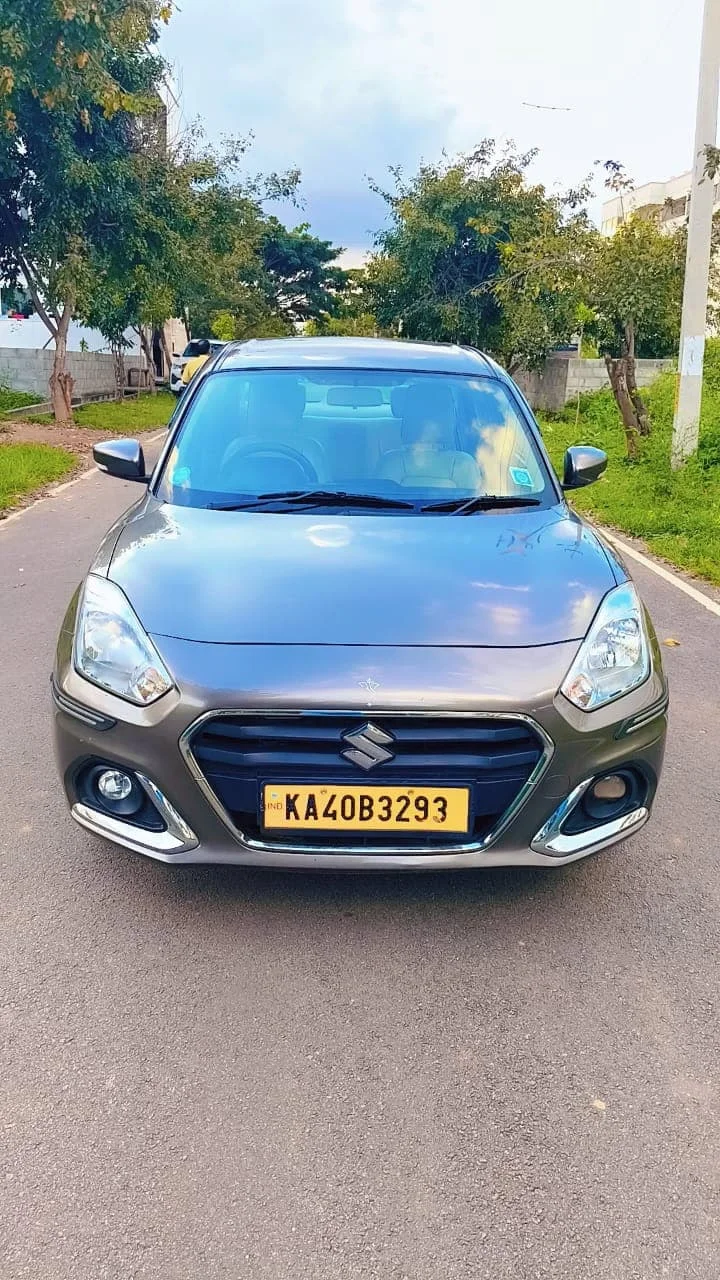 Maruti Dzire sedan cab near Bangalore Airport – front exterior